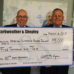 Members Hold Large Check from Starshep to Special Olympics