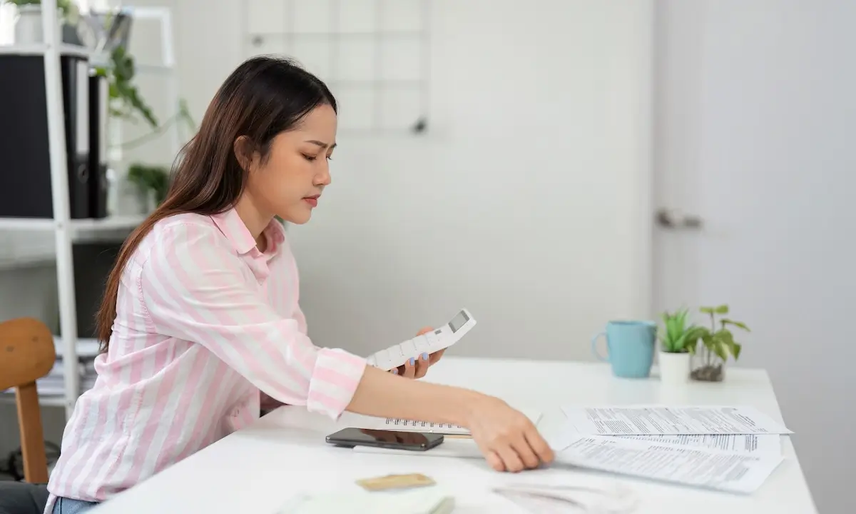 business owner calculating insurance deductibles