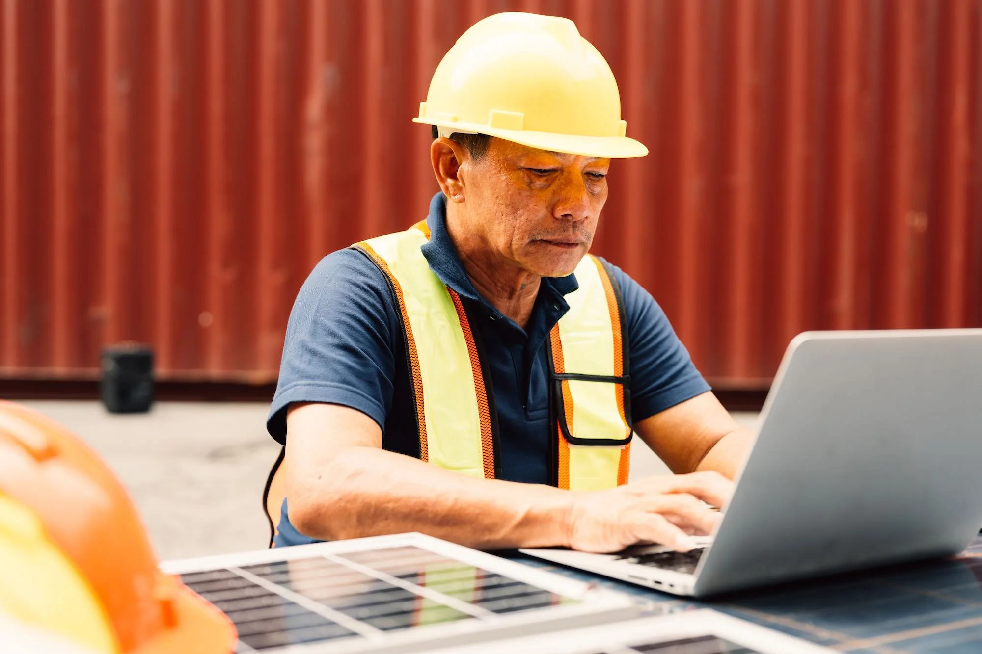 contractor reviewing bid documents construction ()